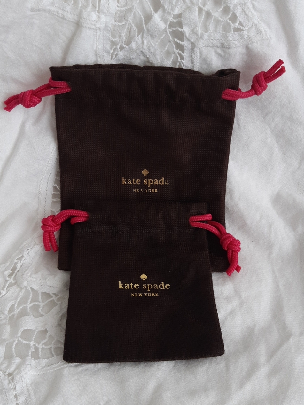 Kate Spade brown and pink jewelry pouches